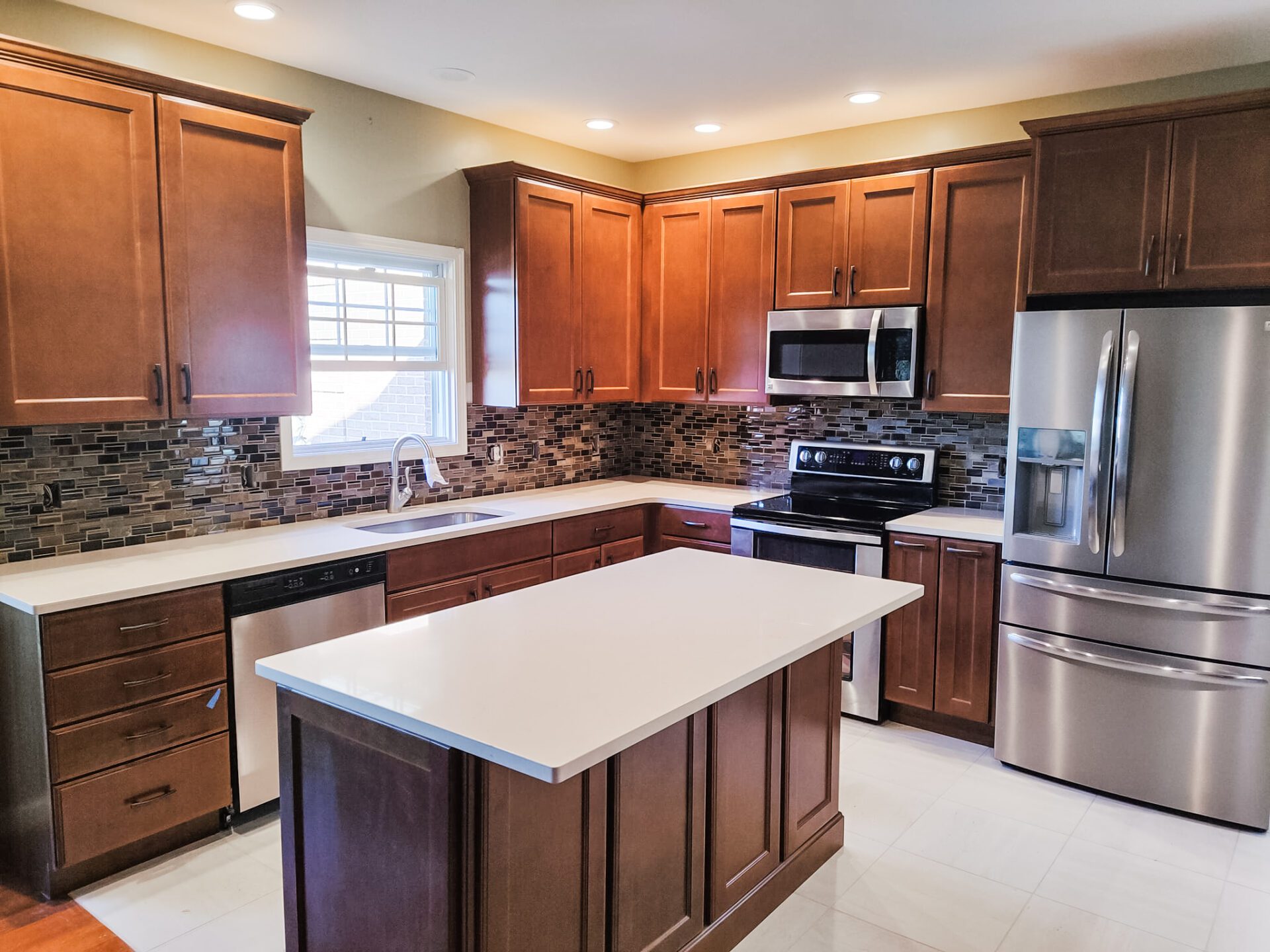 an image of a modular kitchen with lights and chairs