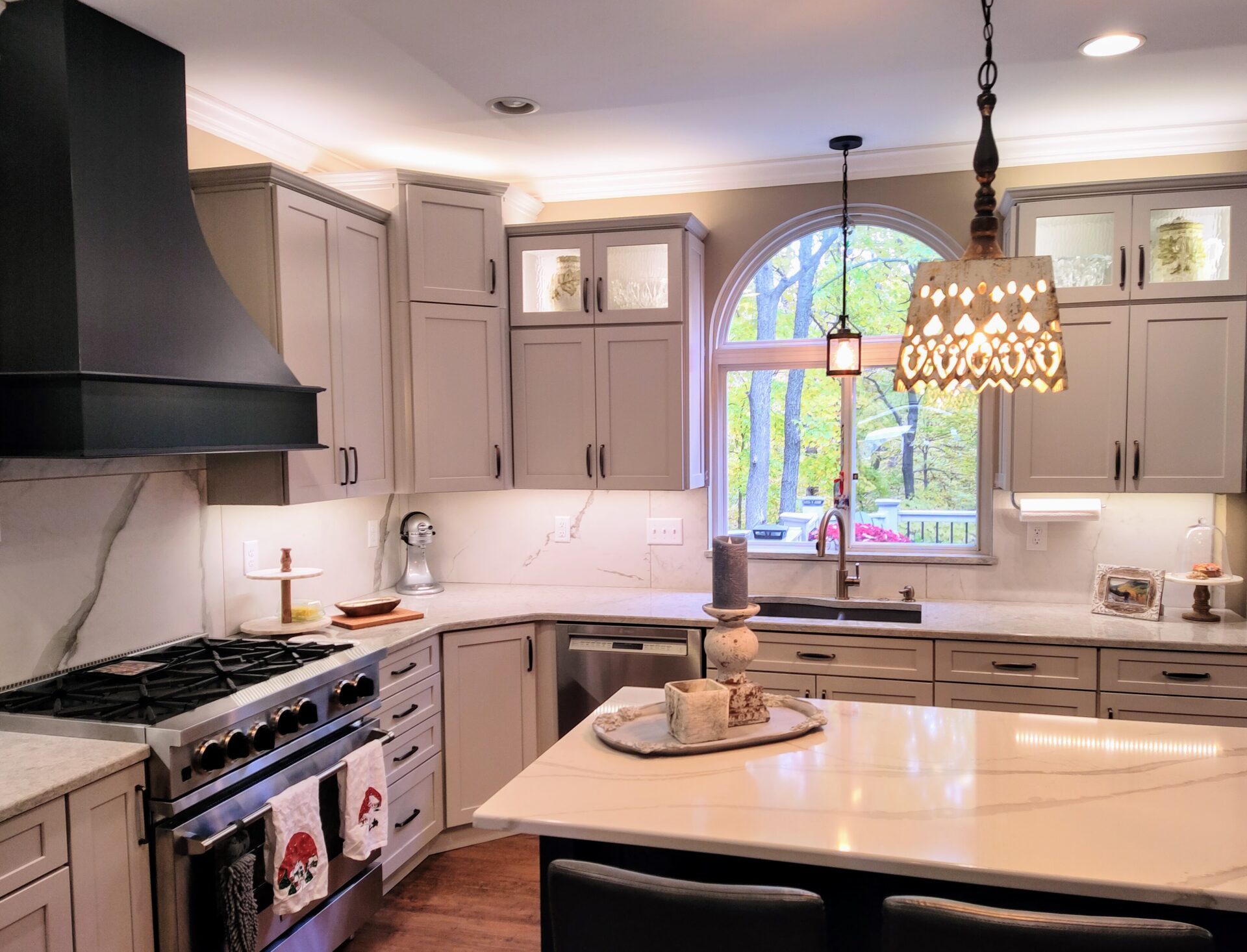 an image of a modular kitchen with lights and chairs