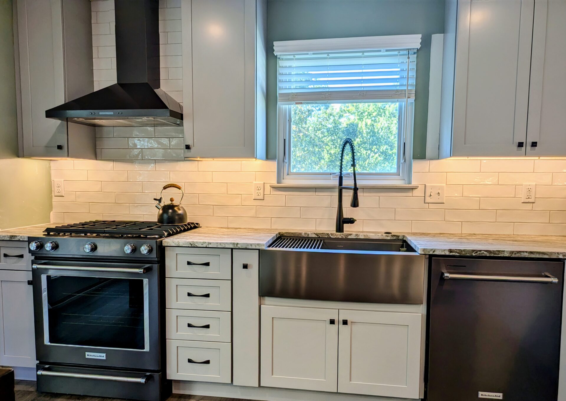 an image of a modular kitchen with lights and chairs